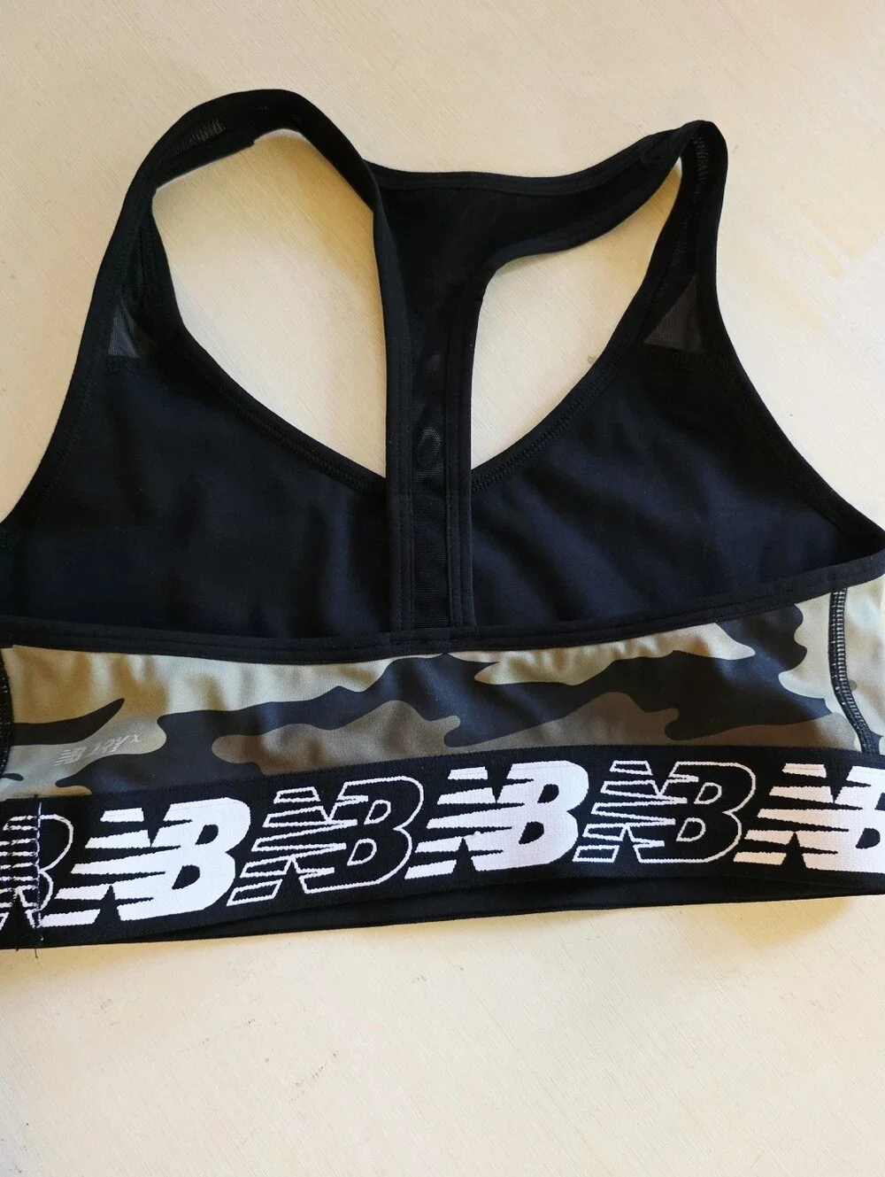 Two bras Calvin Klein New Balance Black & Olive Camo Sports Bra